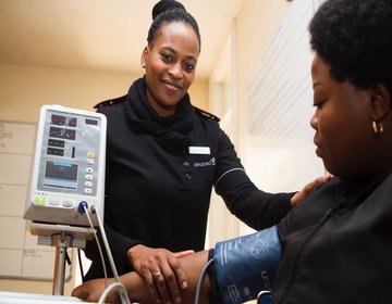 A woman getting her blood pressure tested